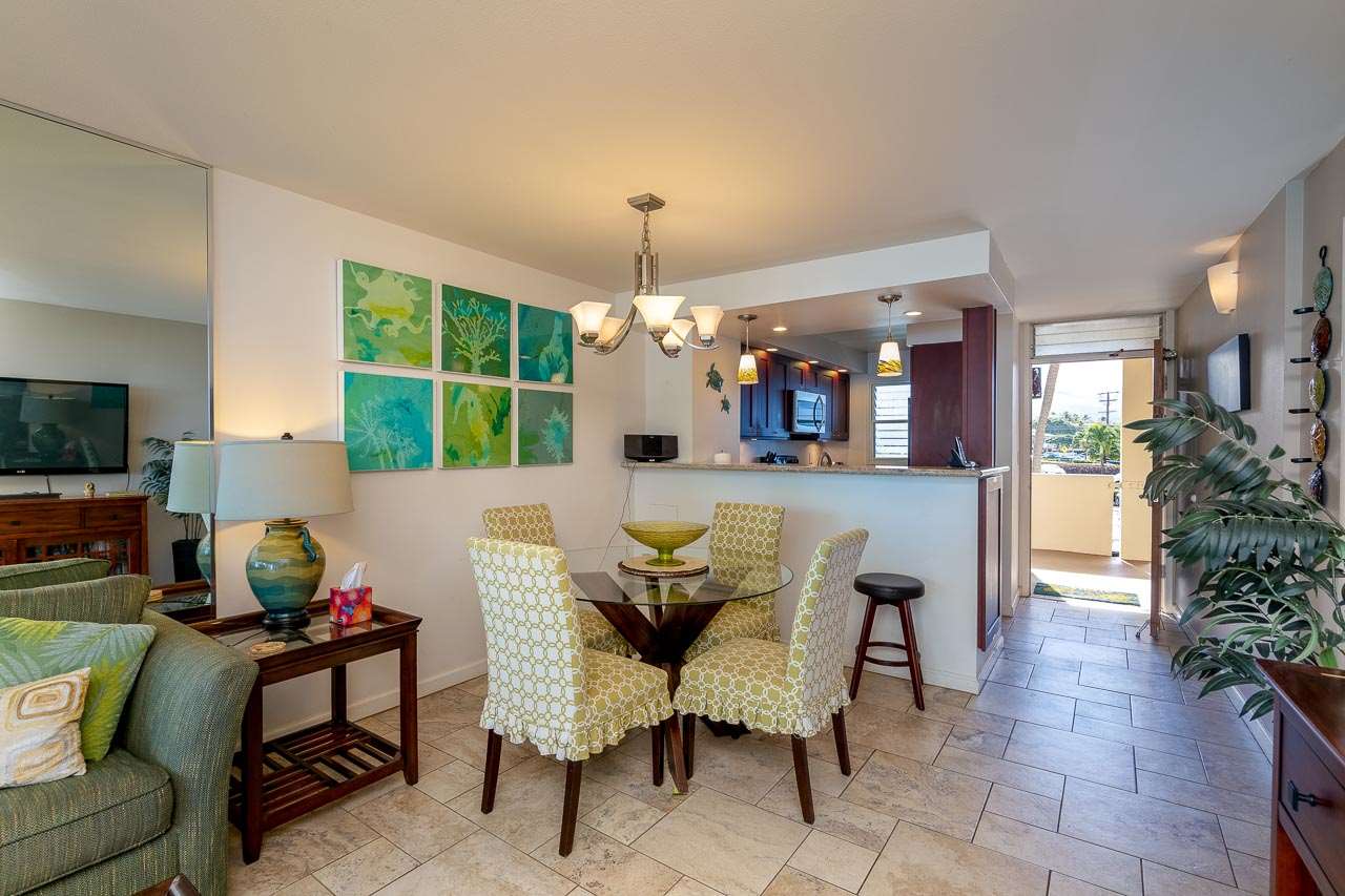 2430 South Kihei Road, Unit 206 Kihei, HI 96753 - Photo 7 of 26 a view of a dining room with furniture window and outside view