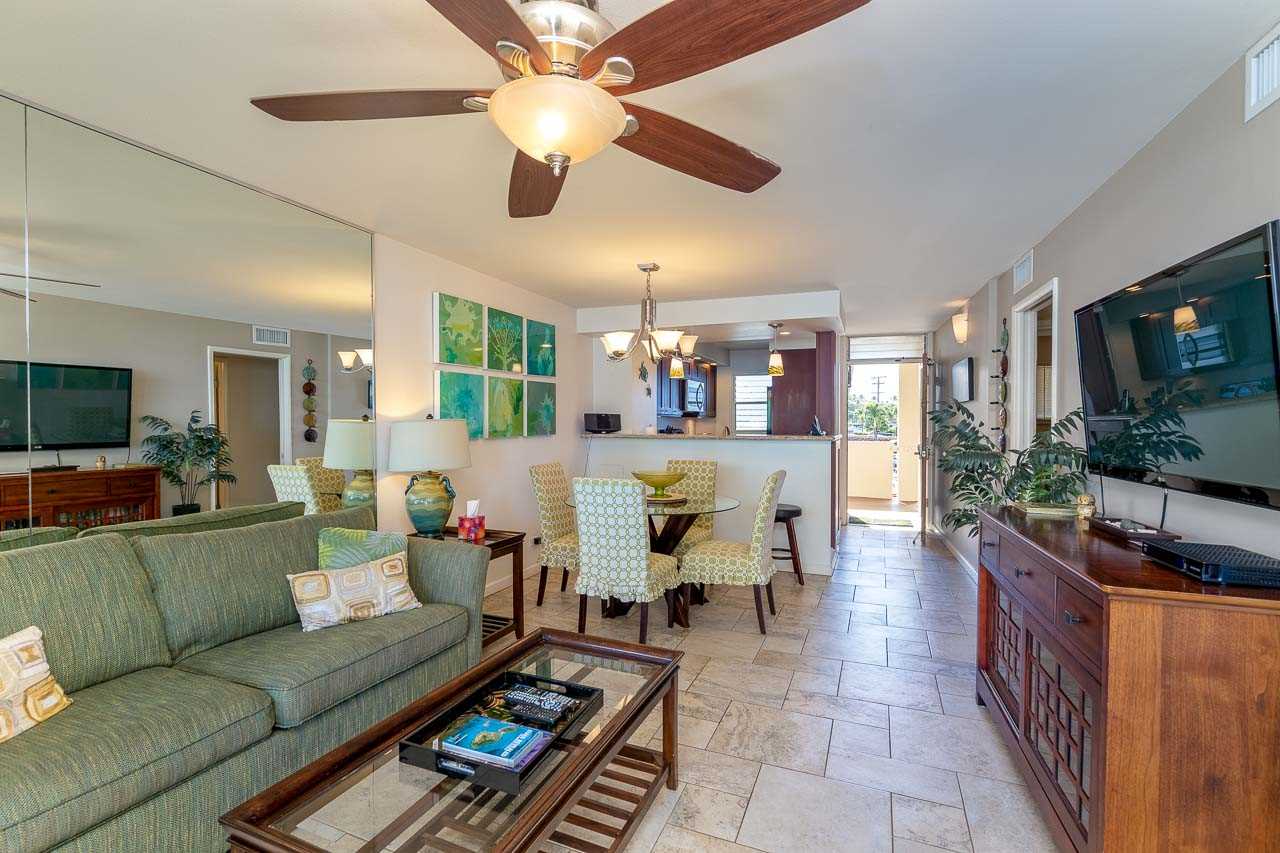 2430 South Kihei Road, Unit 206 Kihei, HI 96753 - Photo 8 of 26 a living room with furniture and a flat screen tv