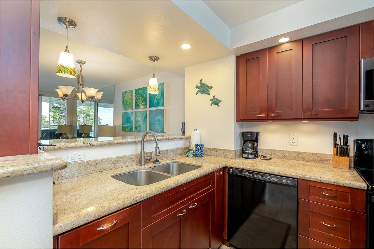 2430 South Kihei Road, Unit 206 Kihei, HI 96753 - Photo 10 of 26 a kitchen with a sink and cabinets