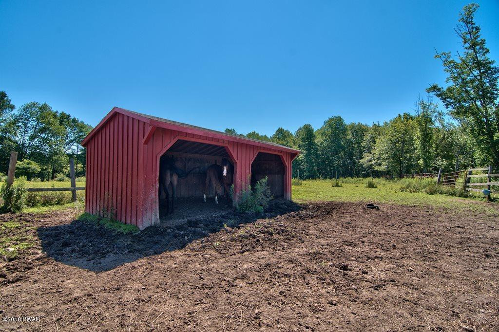 72 Hemlock Road Lake Ariel, PA 18436 - Photo 15 of 48 a view of a barn in the middle of a yard