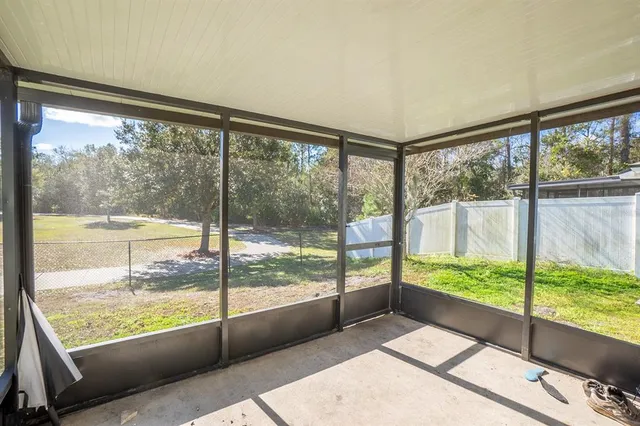 a view of a room with yard from a window