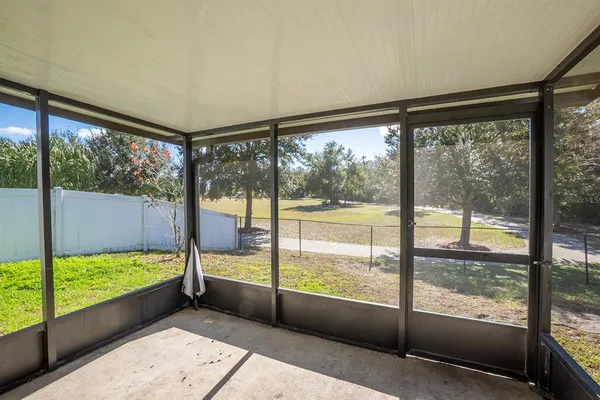 a view of an empty room with a large window