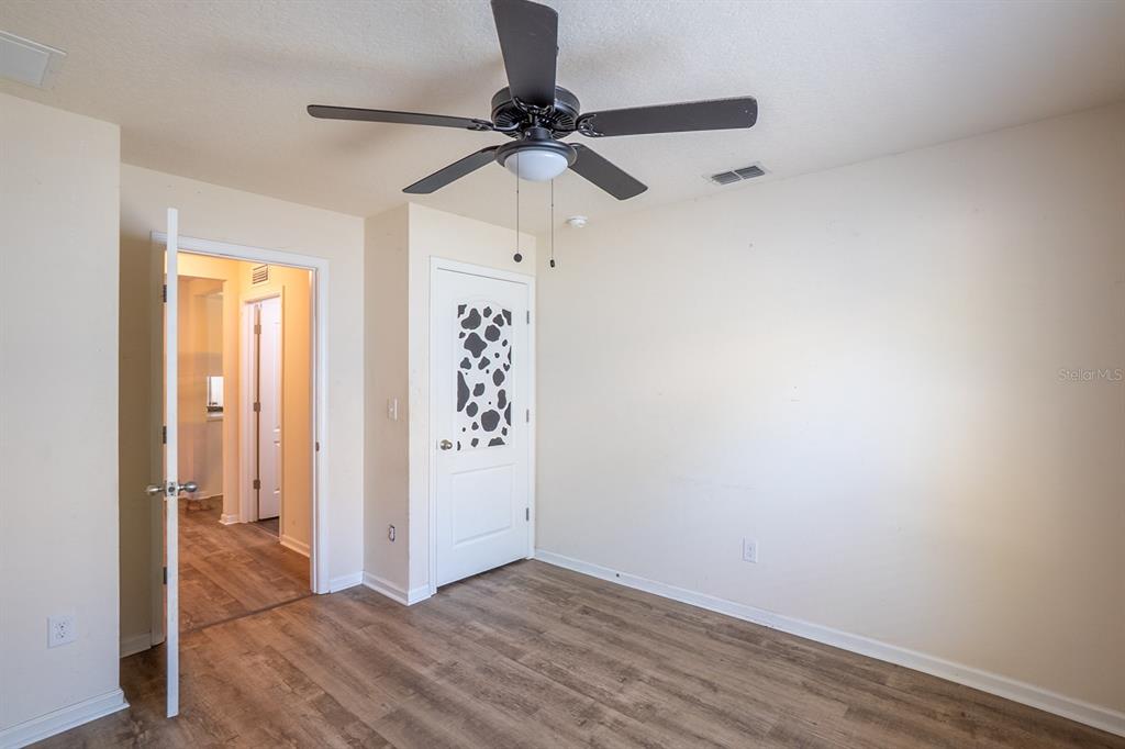 9 Grand Par Court Bunnell, FL 32110 - Photo 10 of 24 a view of a room with wooden floor closet and windows