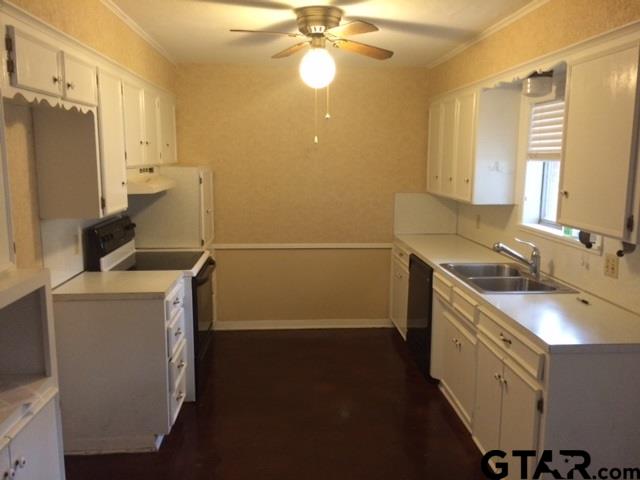 201 Clemson Drive Tyler, TX 75703 - Photo 2 of 9 a bathroom with a sink a toilet and shower