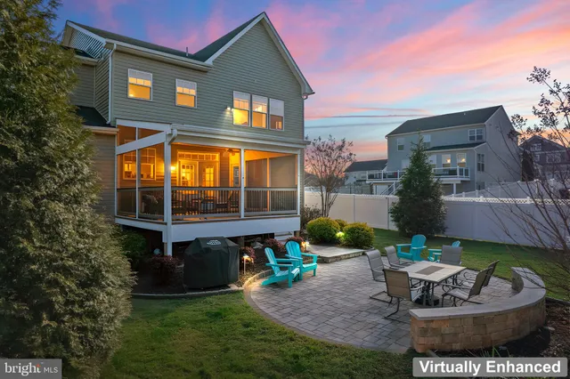 a front view of a house with a garden and patio