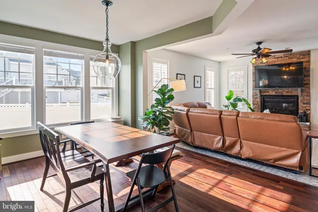 a view of a hallway with wooden floor and entryway