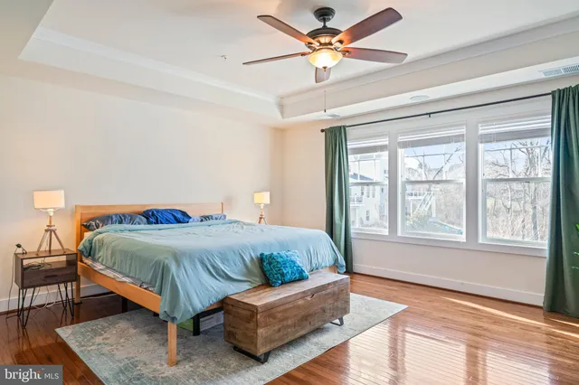 a bathroom with a sink vanity mirror and toilet