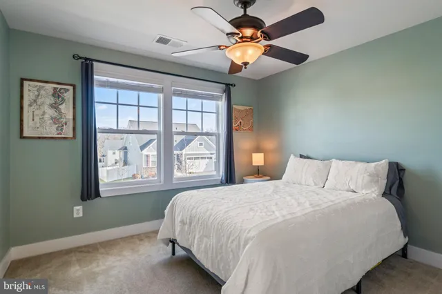 a view of a patio with couches table and chairs and potted plants