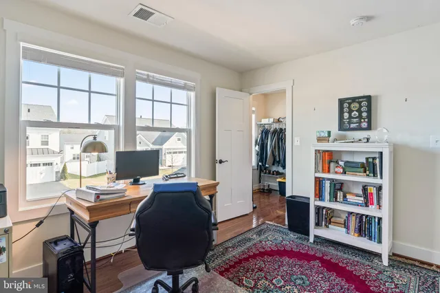 a aerial view of a house with swimming pool and furniture