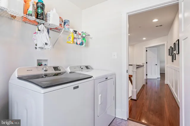 an aerial view of a house with a garden and mountain view
