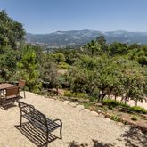 a view of a backyard with sitting area