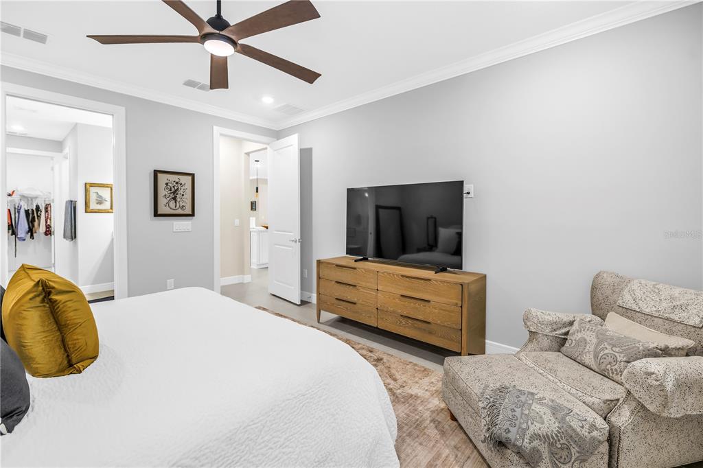 10735 Spring Tide Way Palmetto, FL 34221 - Photo 17 of 41 a bedroom with a bed and furniture