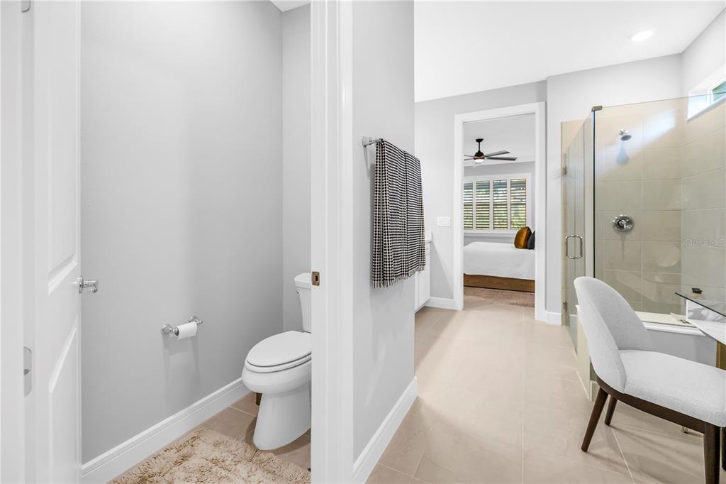 10735 Spring Tide Way Palmetto, FL 34221 - Photo 19 of 41 a bathroom with a sink toilet and shower