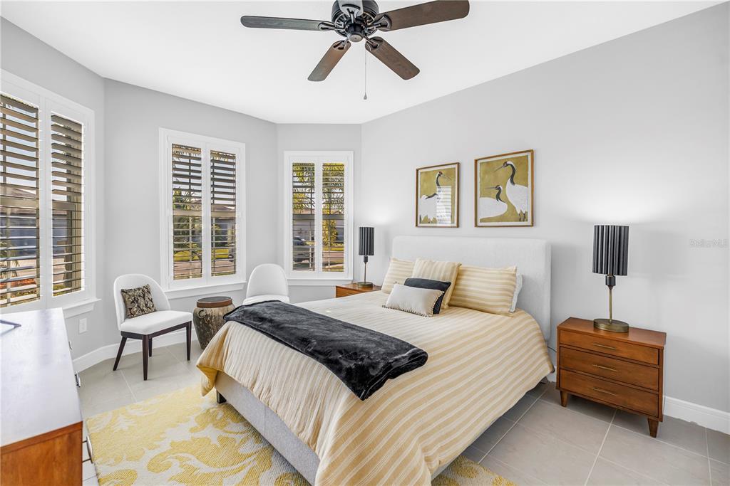 10735 Spring Tide Way Palmetto, FL 34221 - Photo 22 of 41 a bedroom with a bed and a couch