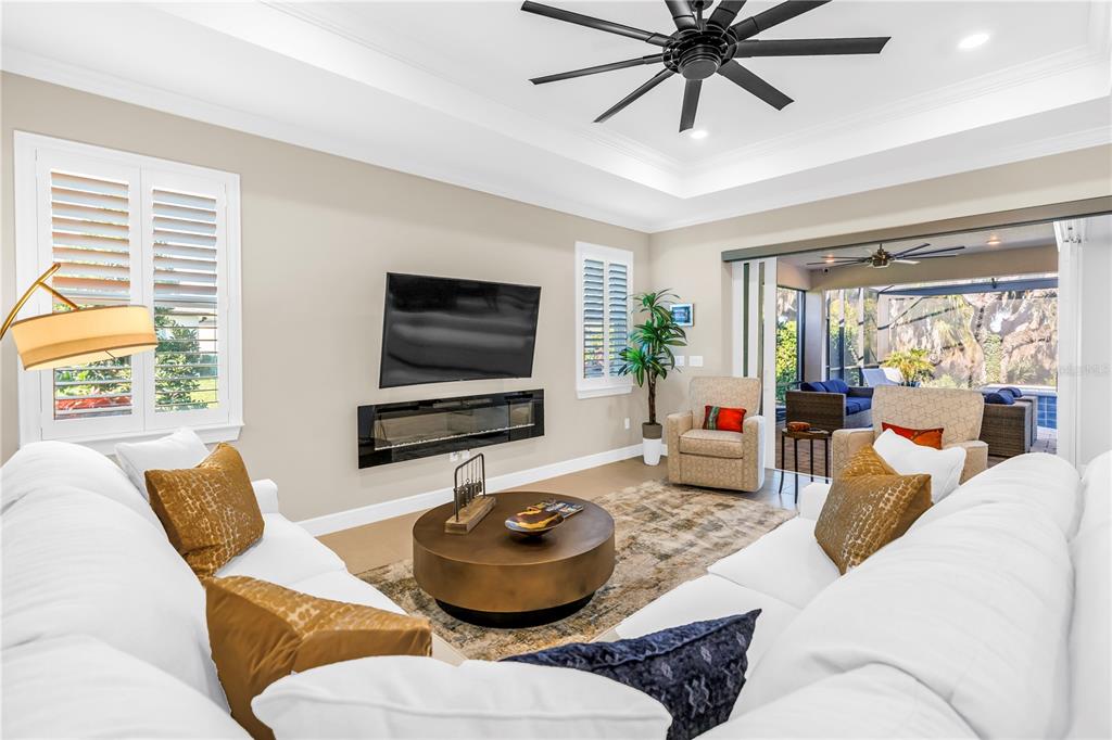 10735 Spring Tide Way Palmetto, FL 34221 - Photo 3 of 41 a living room with furniture and a flat screen tv