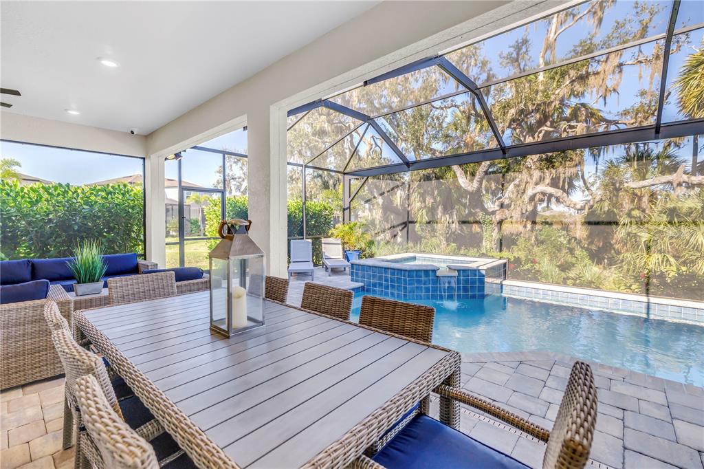 10735 Spring Tide Way Palmetto, FL 34221 - Photo 34 of 41 a living room with furniture and wooden floor