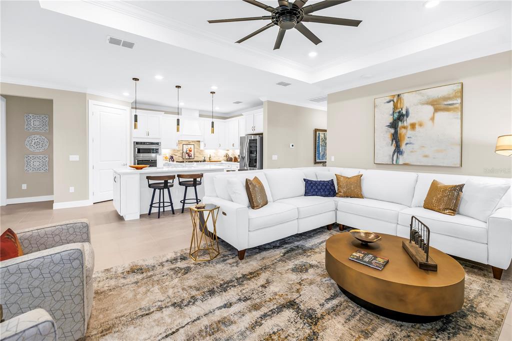 10735 Spring Tide Way Palmetto, FL 34221 - Photo 6 of 41 a living room with furniture and a large window