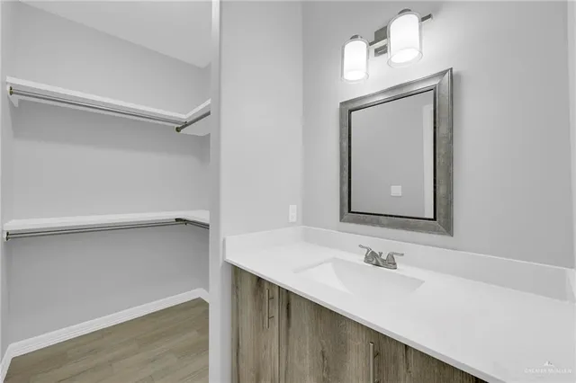 a white toilet sitting next to a shower