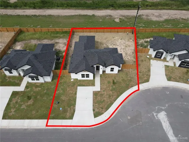 an aerial view of a house with a lake view