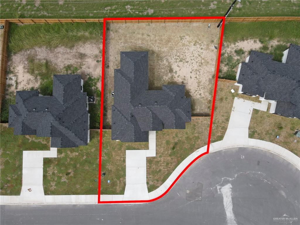 504 Bridget Street Weslaco, TX 78596 - Photo 22 of 23 an aerial view of a house with a lake view
