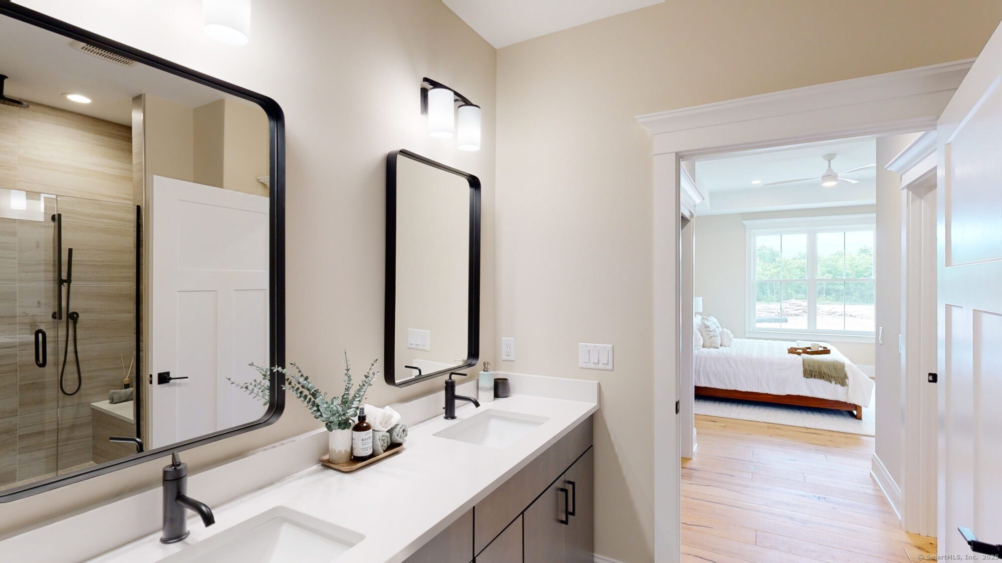 86 Shea Circle, Unit 86 Cheshire, CT 06410 - Photo 8 of 13 a en suite bathroom with a double vanity sink and a mirror