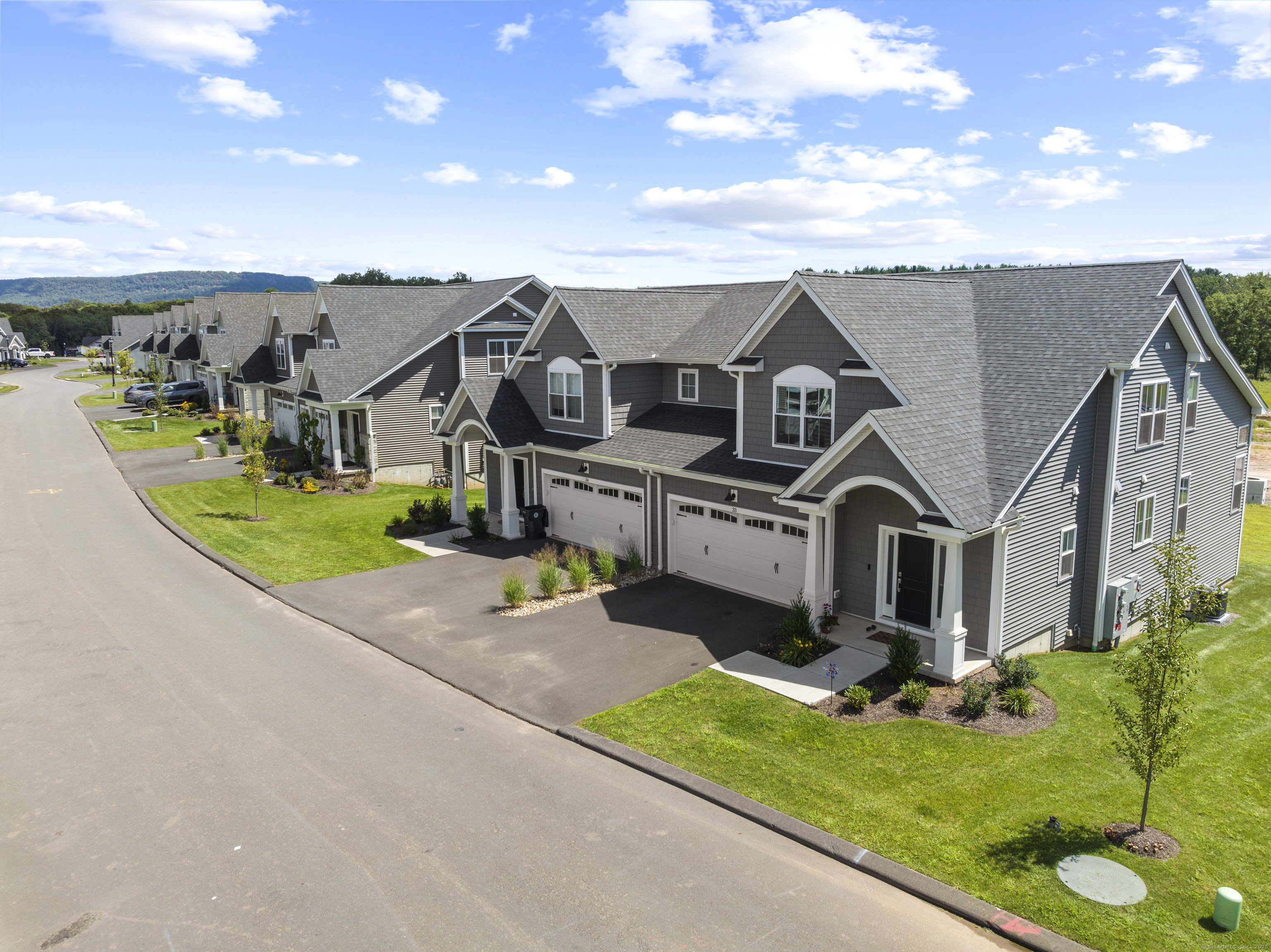 86 Shea Circle, Unit 86 Cheshire, CT 06410 - Photo 9 of 13 an aerial view of a house with a big yard