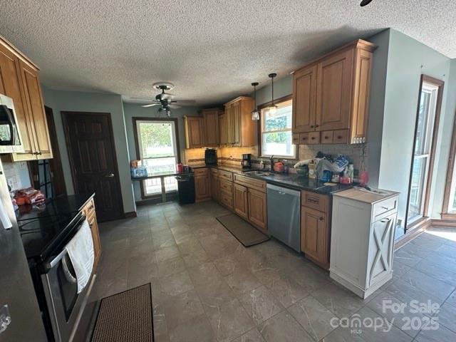 610 Old Dutch Road West Indian Trail, NC 28079 - Photo 4 of 30 a kitchen with stainless steel appliances granite countertop a sink stove and refrigerator