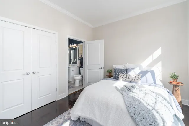 a bedroom with a bed and a closet