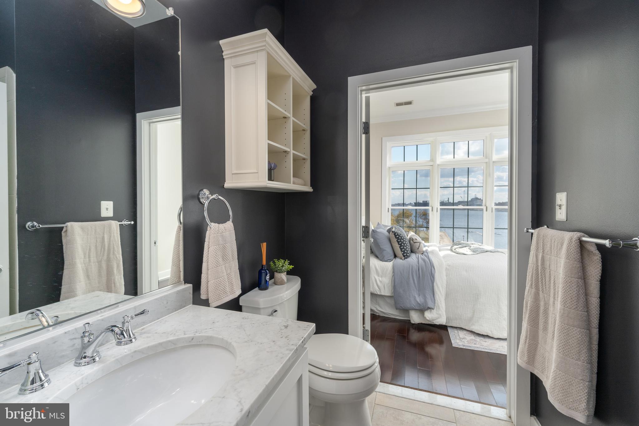 1500 Thames Street, Unit 401 Baltimore, MD 21231 - Photo 12 of 54 a bathroom with a sink toilet and shower