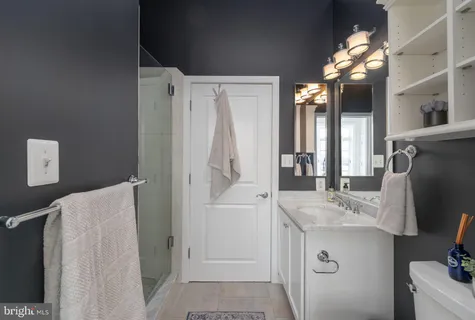 a spacious bedroom with a large bed and a large window