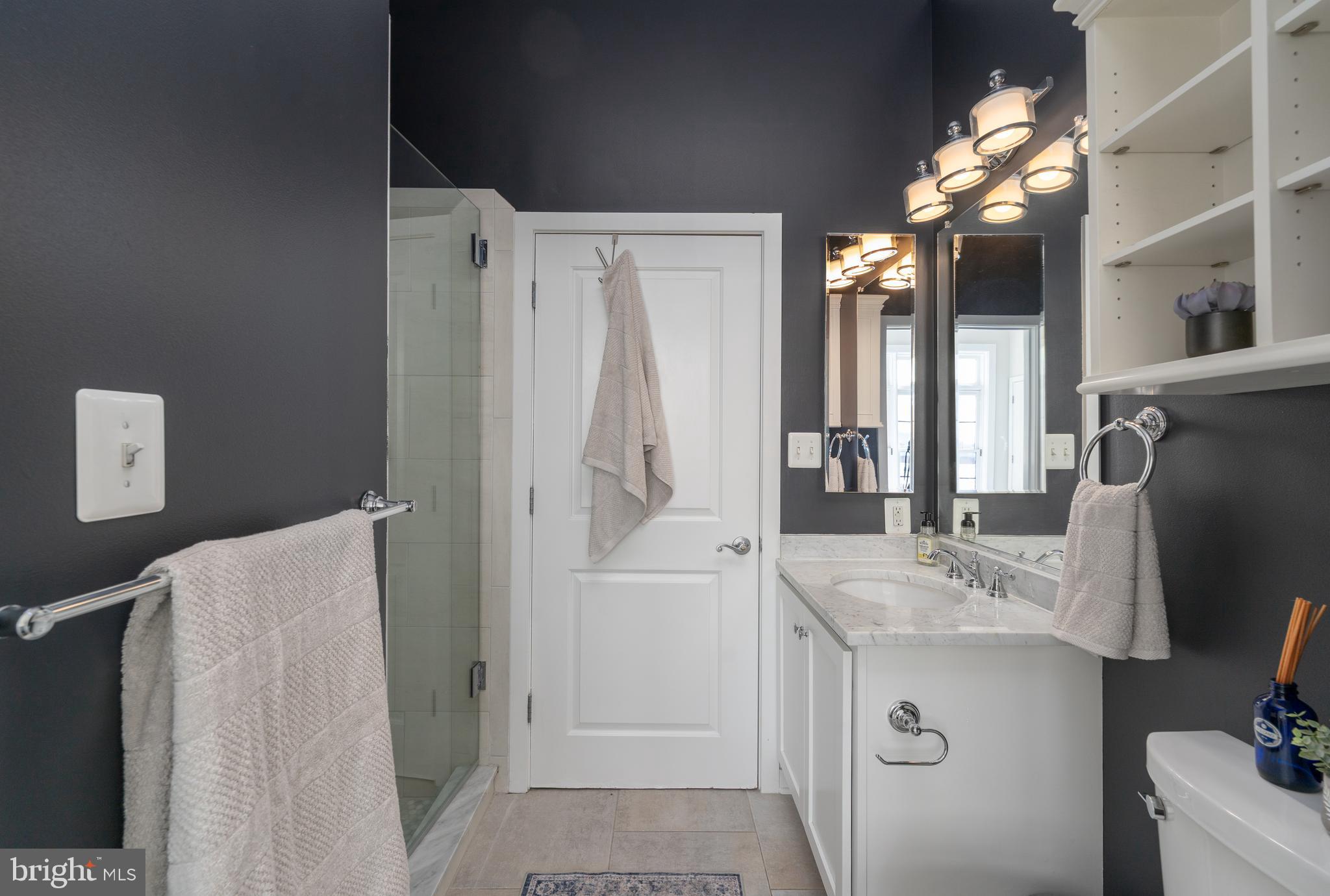 1500 Thames Street, Unit 401 Baltimore, MD 21231 - Photo 14 of 54 a bathroom with a sink vanity tub and shower
