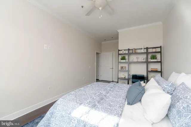 a bathroom with a granite countertop sink toilet and a mirror