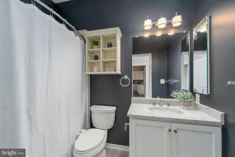 a view of entryway and gallery with wooden floor