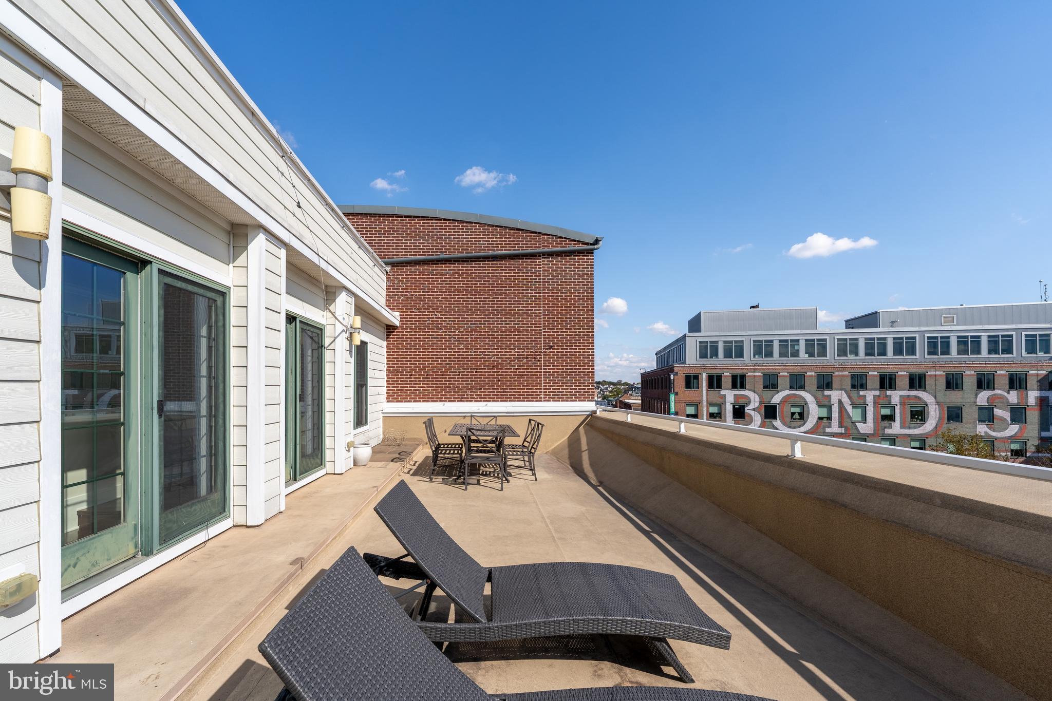 1500 Thames Street, Unit 401 Baltimore, MD 21231 - Photo 27 of 54 a balcony with a couch