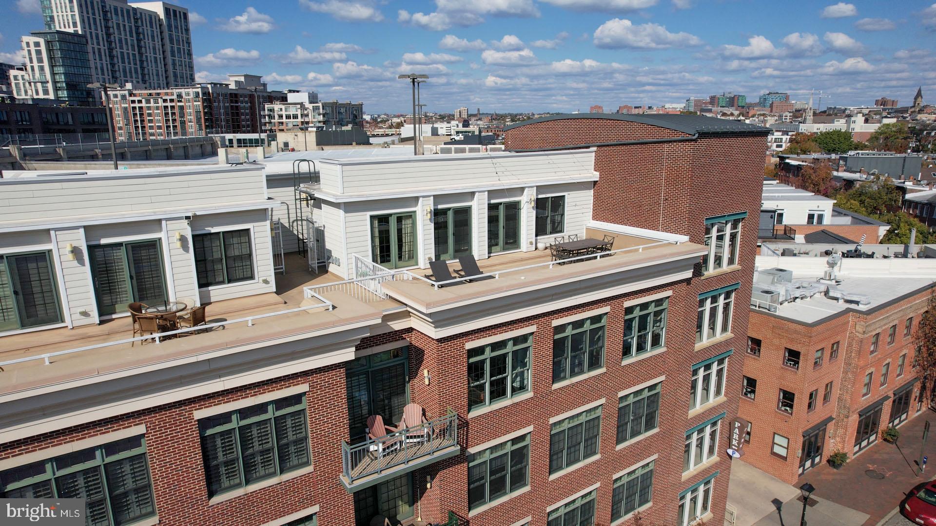 1500 Thames Street, Unit 401 Baltimore, MD 21231 - Photo 31 of 54 a view of a building with a lot of windows