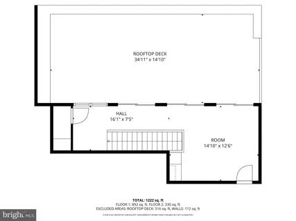 a picture of a room with a white wall and a white refrigerator