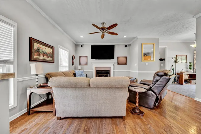 a kitchen with stainless steel appliances granite countertop a sink a stove cabinets and a window
