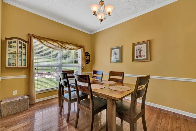 a spacious bathroom with a tub sink and mirror