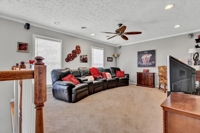 a livingroom with workspace and a window
