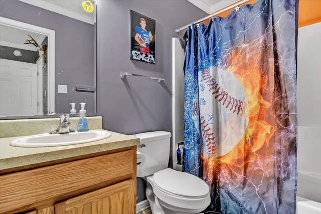 a spacious bedroom with two beds and a chandelier