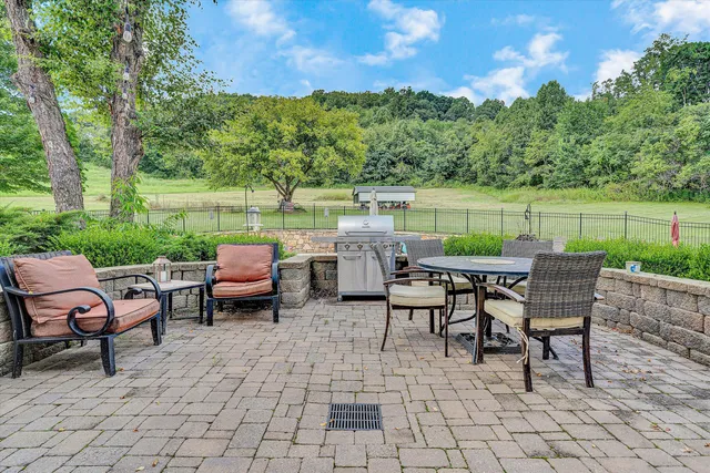 a view of a garden with a building in the background