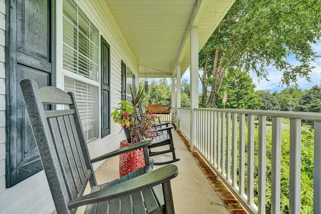 a garden with trees in the background