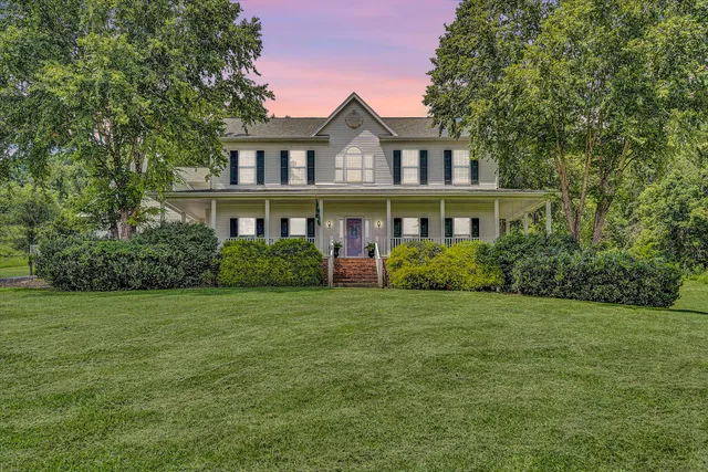 a swimming pool with outdoor seating and yard