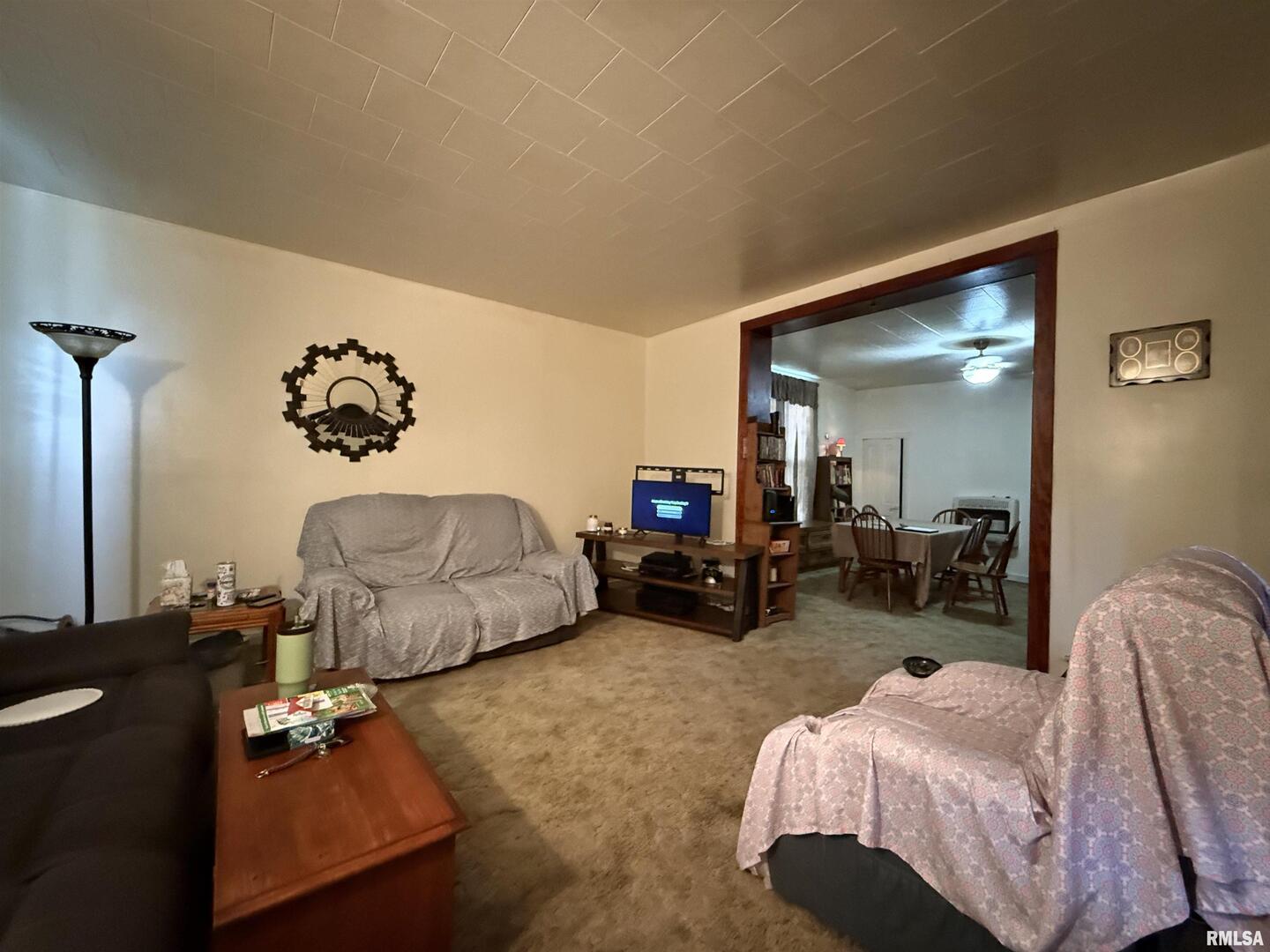 103 Baltimore Street Ridgway, IL 62979 - Photo 11 of 21 a bedroom with bed and a couch