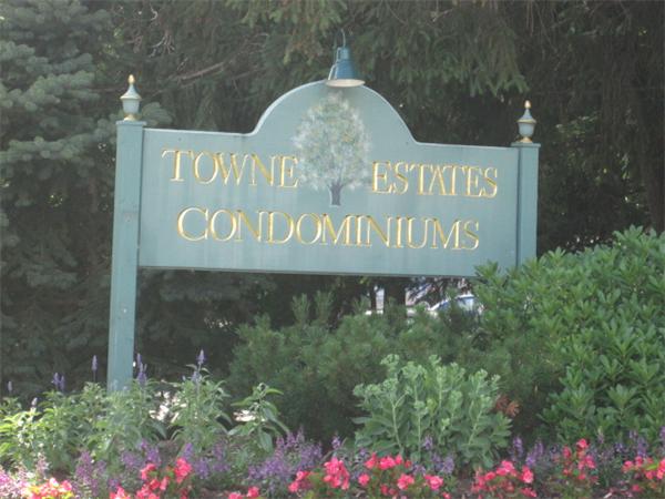 a sign broad in front of flowers