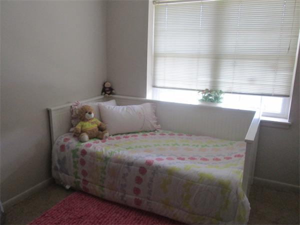 199 Lake Shore Road, Unit 4 Boston, MA 02135 - Photo 11 of 13 a bedroom with a bed and window