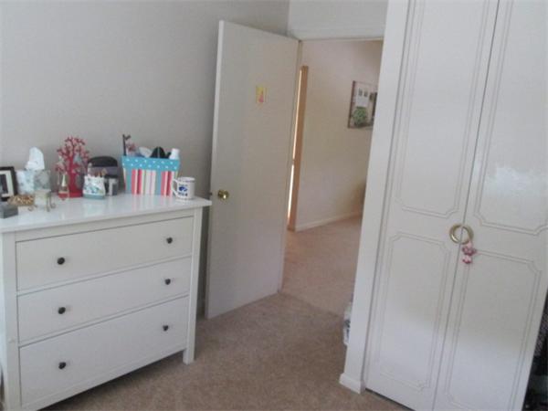 199 Lake Shore Road, Unit 4 Boston, MA 02135 - Photo 10 of 13 a bathroom with a sink vanity and mirror