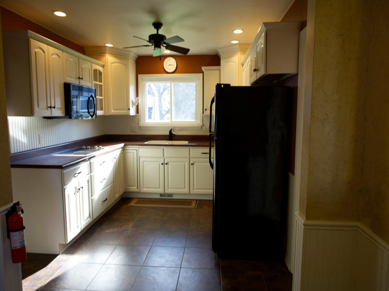 308 Granada Road Bloomington, IL 61701 - Photo 14 of 38 a kitchen with stainless steel appliances granite countertop a refrigerator a sink and a microwave