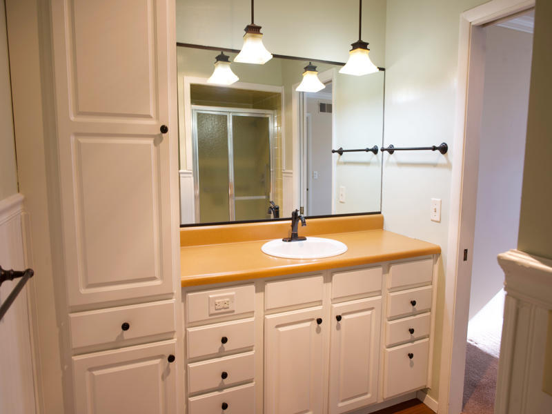 308 Granada Road Bloomington, IL 61701 - Photo 18 of 38 a bathroom with a sink and a mirror