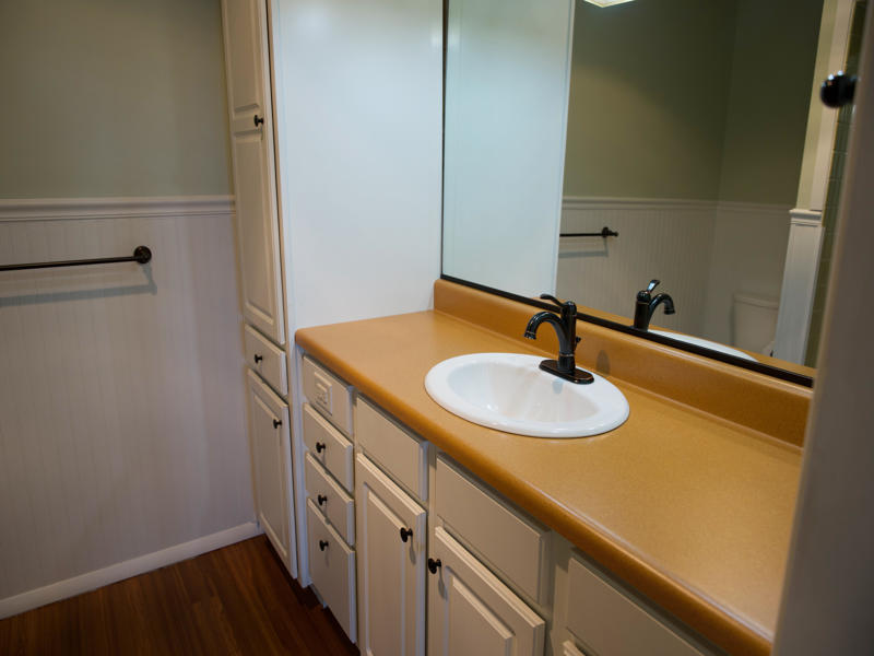 308 Granada Road Bloomington, IL 61701 - Photo 19 of 38 a bathroom with a sink and a mirror